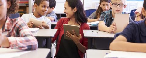 teacher teaching students in school
