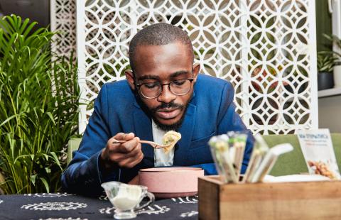 Person eating alone in a restaurant