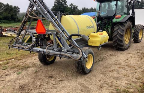Boom Sprayer on back of a tractor
