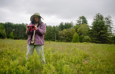 Woman collecting data in field