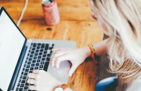 person on a computer looking for online resources 