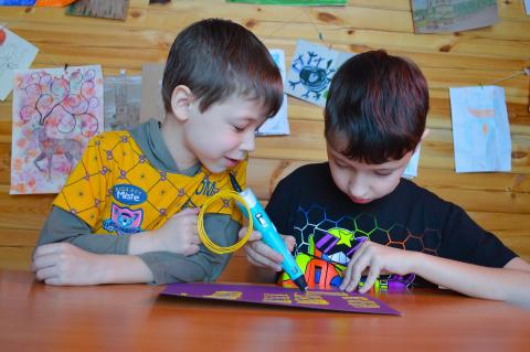 Two boys crafting.